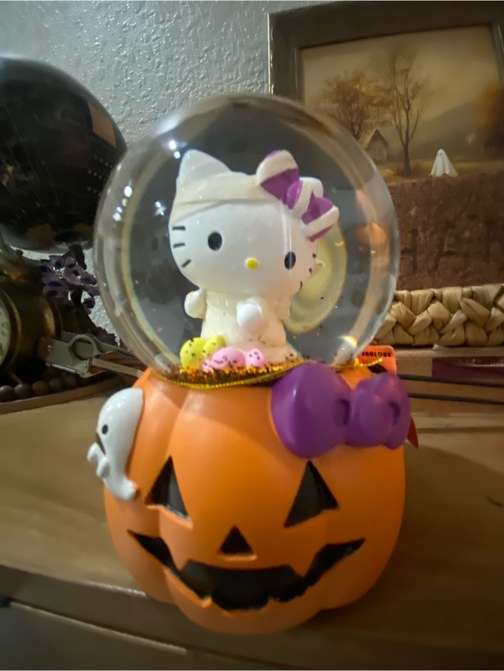 Hello Kitty Orange Pumpkin musical Snow Globe with Purple Bow Accent